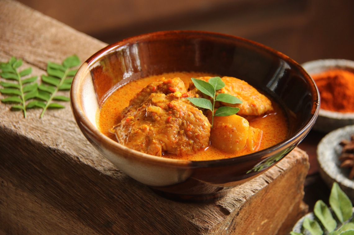 Bowl of steaming hot chicken curry